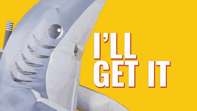 an inflatable shark is holding a cardboard box with a sticker on it that says ' i.i. '