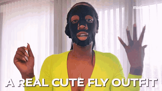 a woman with a black mask on her face says a real cute fly outfit ..