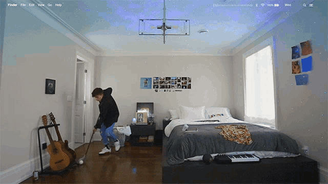 a bedroom with a bed and a guitar and a keyboard