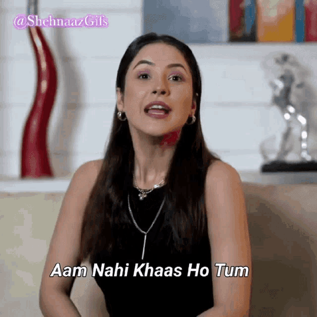 a woman says aam nahi khaas ho tum in front of a red vase