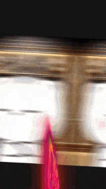 a blurred image of a person 's face with a red object coming out of it