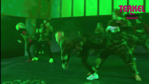 a group of people dancing on a stage with the words terkel the musical behind them