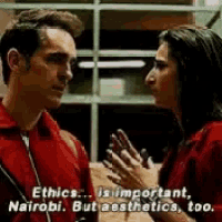 a man and a woman are talking to each other and the woman is talking about ethics .