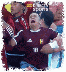 a man wearing a jersey with the number 18 on it is crying