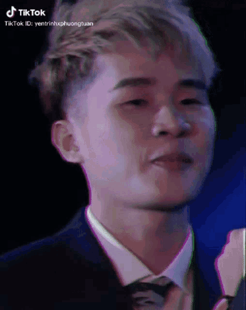 a close up of a man 's face with a tiktok id in the corner