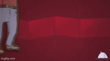 a blurry picture of a person 's feet on a red background