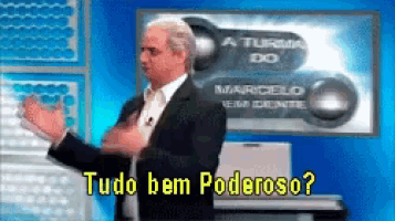 a man in a suit and tie is standing in front of a sign that says tudo bem poderoso