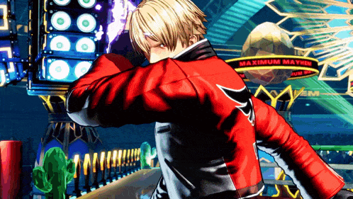 a man in a red jacket is standing in front of a sign that says " maximum mayhem "