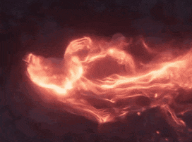a close up of a red glowing object on a dark background