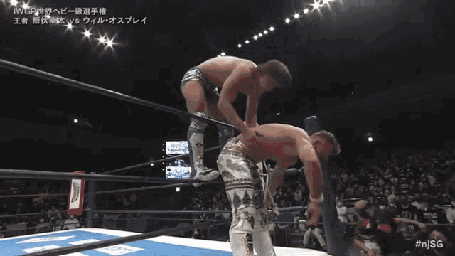a man in a wrestling ring with the word iwgp on the bottom
