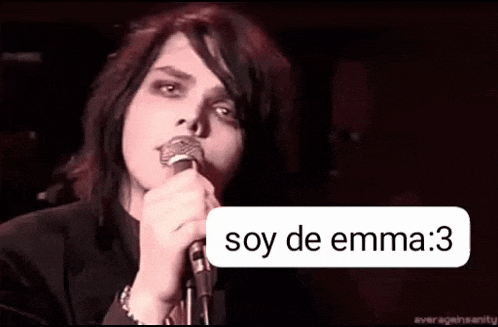 a person is singing into a microphone with a speech bubble that says `` soy de emma '' .