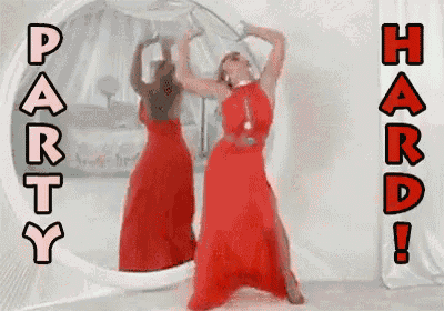 a woman in a red dress is dancing in front of a mirror with the words party hard written above her