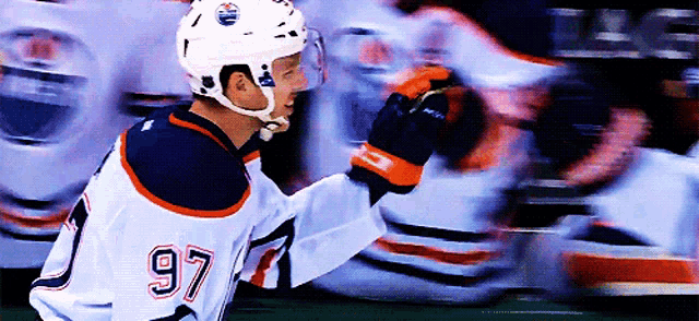 a hockey player wearing a jersey with the number 97