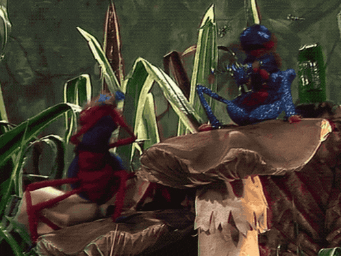 a couple of bugs are sitting on a mushroom in a jungle