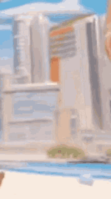 a naked woman in a bikini is standing next to a swimming pool .