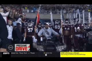 espn is showing a football game with a pregame drive ad on the screen