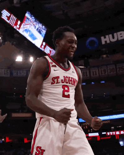 a basketball player for st john 's is celebrating