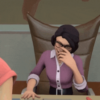 a woman in a purple shirt and glasses is sitting at a desk with her hand on her nose .