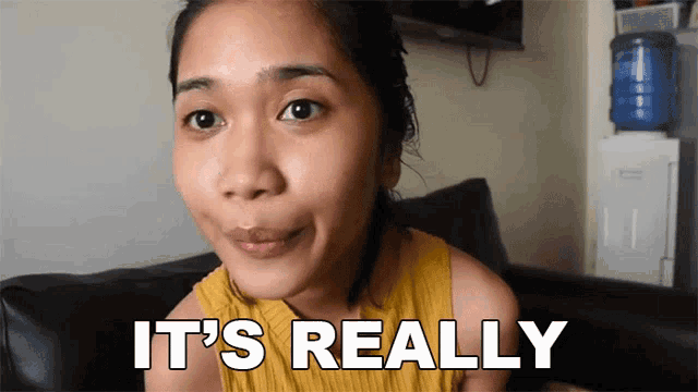 a woman sitting on a couch with the words it 's really above her