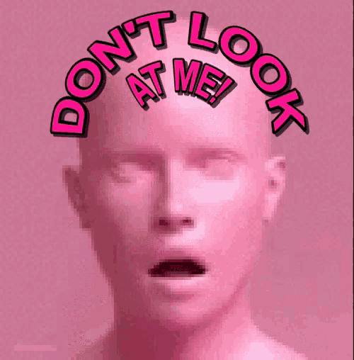 a man 's head with the words do n't look at me written on it