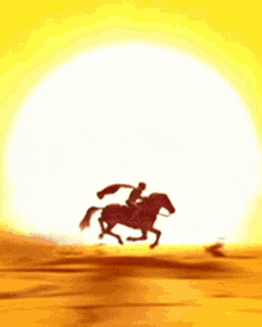 a man is riding a horse in the desert