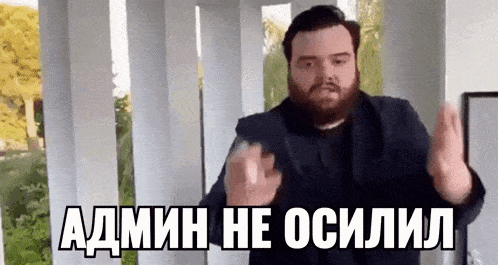 a man with a beard is making a funny face while standing in front of a balcony .
