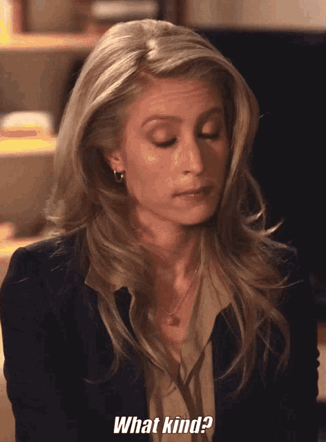 a woman says what kind while looking down