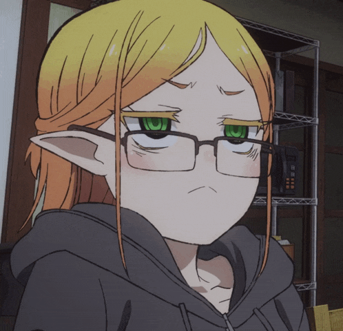 a girl with blonde hair and green eyes is wearing glasses and a hoodie