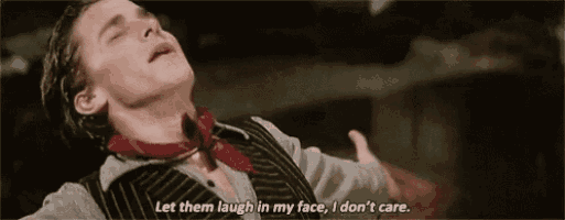a man is laying down with his eyes closed and saying `` let them laugh in my face , i don 't care ''