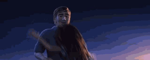 a boy and a girl are hugging each other in a movie .