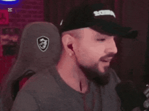 a man with a beard wearing a cap that says sosa on it