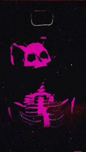a pink skeleton is holding a laptop in a black background