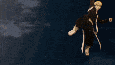 a blurry picture of a person jumping over a fence