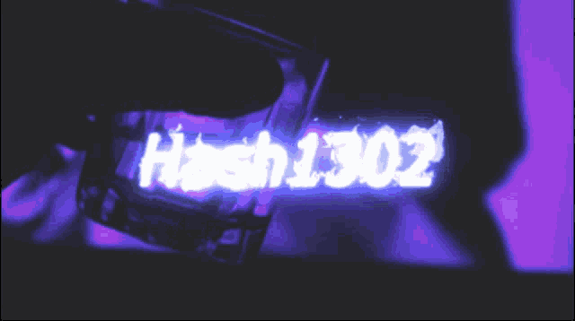 a neon sign that says hash1301z is glowing in the dark
