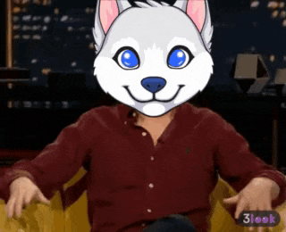 a man with a husky mask on his face is sitting in a chair