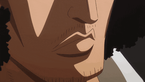 a close up of a man 's mouth with a beard