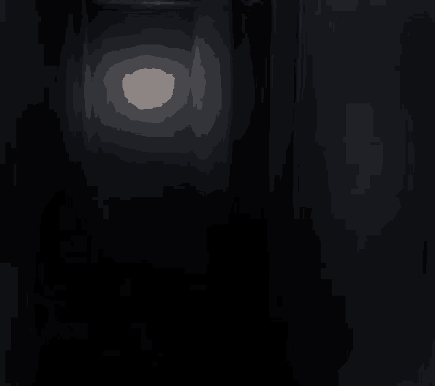 a door with a smiley face on it is lit up in the dark .