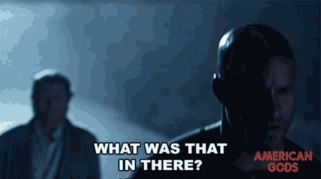 a man says what was that in there while another man stands behind him