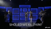 a group of people dancing on a stage with the words should we kill him written on the bottom