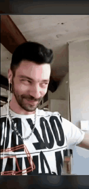 a man wearing a t-shirt that says ' axxo ' on it