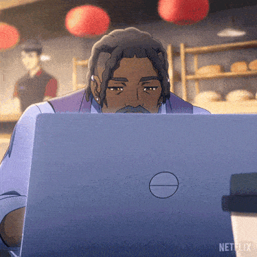 a man is looking at a dell laptop in a netflix ad