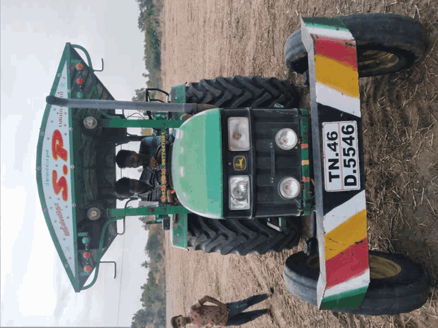 a john deere tractor with a license plate that says tn 46 d 5456