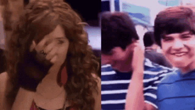 a woman is covering her face with her hand next to a boy .