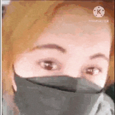a close up of a person wearing a mask