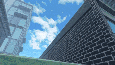 looking up at a brick wall with a blue sky in the background