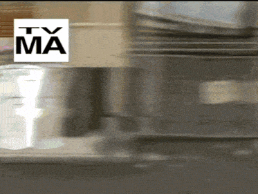 a tv ma logo is above a blurred image of a kitchen