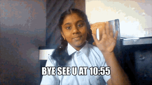 a girl says bye see u at 10:55 with her hand