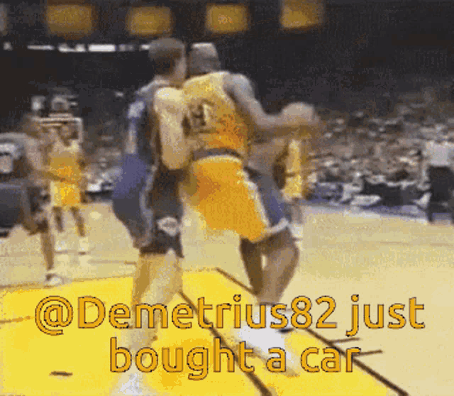 a basketball player with the number 14 on his jersey is being fouled by another player