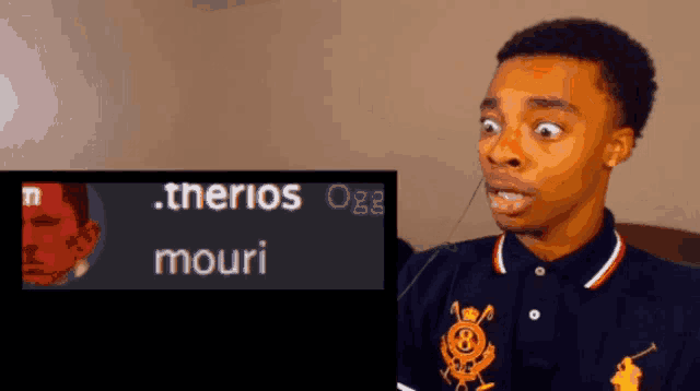a man with a surprised look on his face next to a screen that says .therios oge mouri