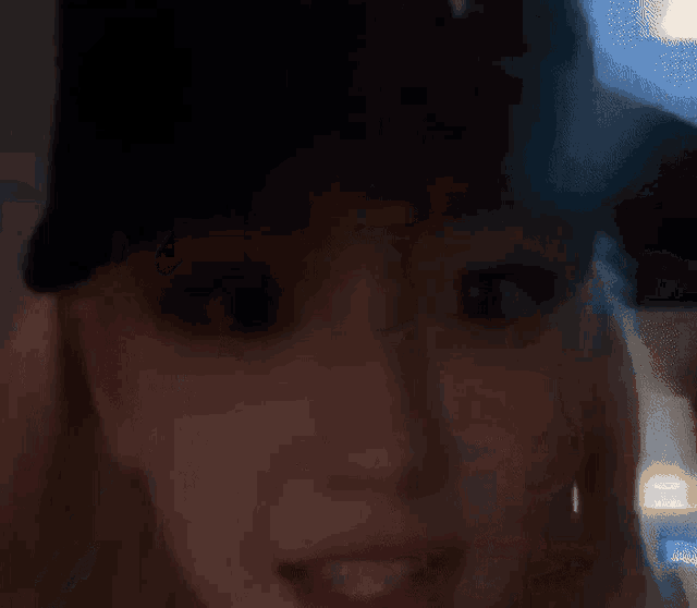 a close up of a woman wearing a hat